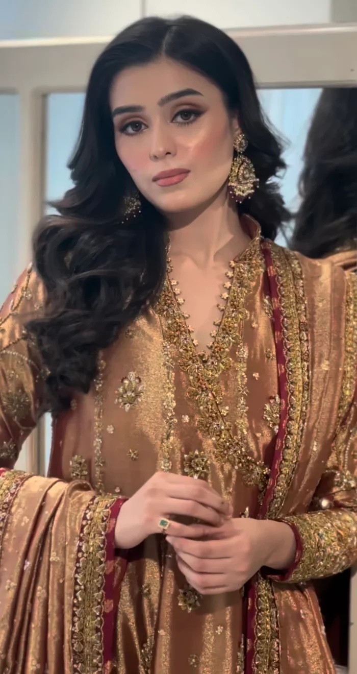 Haris Shakeel Aswad Pakistani fashion outfit in gold tones.